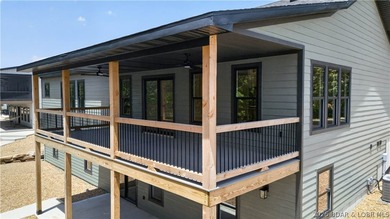 Stunning new-construction waterfront home at the Lake of the - photo 9