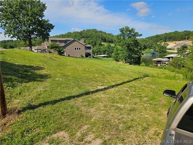 Ready to build on an almost level lot with central water & sewer - photo 2
