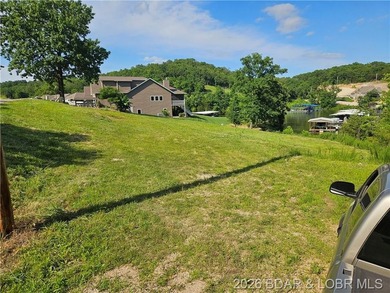 Ready to build on an almost level lot with central water & sewer - photo 2