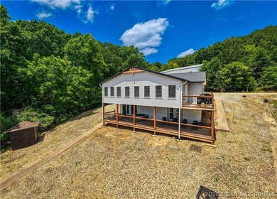 Lakefront living on 2 private acres at the 8MM near Laurie! - photo 3