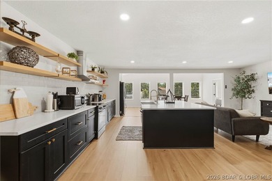 Lakefront living on 2 private acres at the 8MM near Laurie! - photo 6