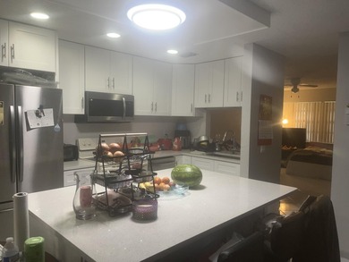 Beautiful home featuring a modern kitchen with white cabinets - photo 21