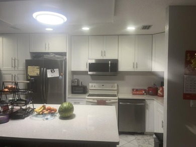 Beautiful home featuring a modern kitchen with white cabinets - photo 29