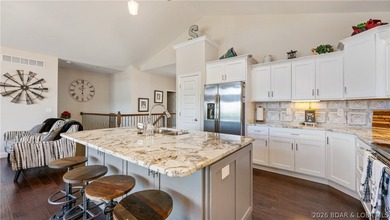 Lake view living with a boat slip at The Villas at Tuscany! This - photo 6