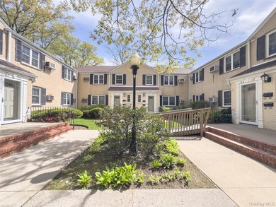 Tucked within the quiet, tree-lined Estates at Bayside, this - photo 2