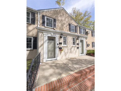 Tucked within the quiet, tree-lined Estates at Bayside, this - photo 3