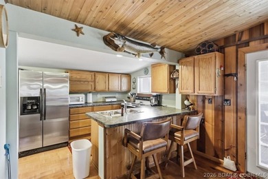 Enjoy the Lake of the Ozarks lifestyle with this charming Rocky - photo 8