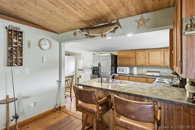 Enjoy the Lake of the Ozarks lifestyle with this charming Rocky - photo 9