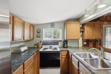 Enjoy the Lake of the Ozarks lifestyle with this charming Rocky - photo 10