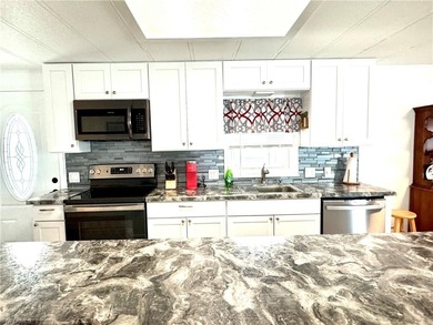 PARADISE AWAITS! Canal front home Gulf access 15 minutes to the