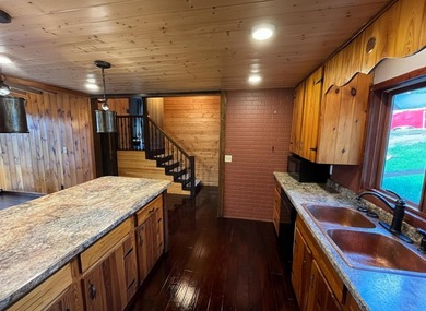 This 4BR, 2BA Rainy Lake property offers 100' of accessible - photo 16