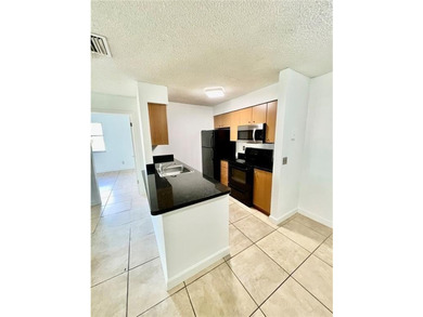 Vacant. all tile , granite countertop, 2 parking spaces - photo 17