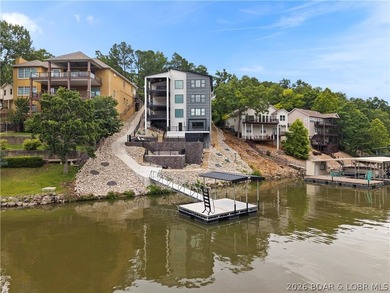 Experience luxury lakefront living in this fully furnished - photo 1