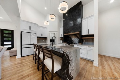Experience luxury lakefront living in this fully furnished - photo 2