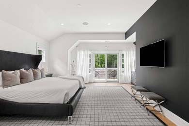 Enter through a dramatic double-height foyer into the refined - photo 22