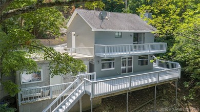 Located at the 3MM of the Big Niangua, this 3-bedroom, 2.5-bath - photo 1