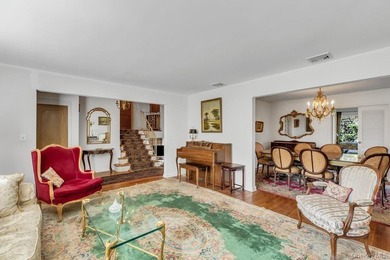 This Munsey Park brick split-level home is situated on a - photo 4