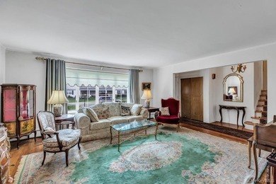 This Munsey Park brick split-level home is situated on a - photo 5