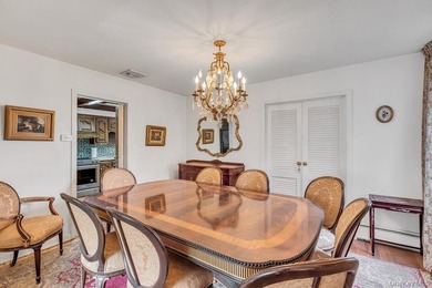 This Munsey Park brick split-level home is situated on a - photo 6