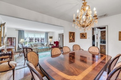This Munsey Park brick split-level home is situated on a - photo 7