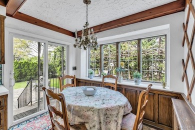 This Munsey Park brick split-level home is situated on a - photo 9