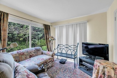 This Munsey Park brick split-level home is situated on a - photo 10