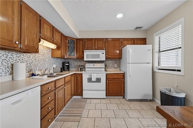 Top-floor condo living in the heart of Osage Beach! Located in - photo 9