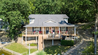 Designed with gathering in mind, this unique lake home was - photo 1