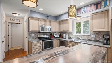 Designed with gathering in mind, this unique lake home was - photo 5