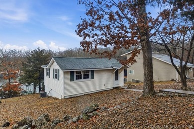Discover this unique 2-bedroom, 1-bath lakefront cabin offering - photo 1