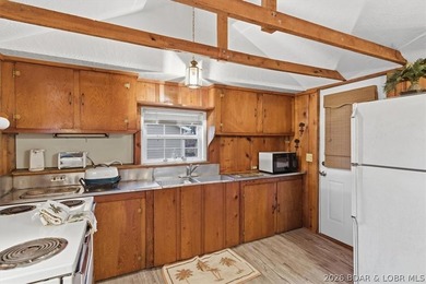 Discover this unique 2-bedroom, 1-bath lakefront cabin offering - photo 9