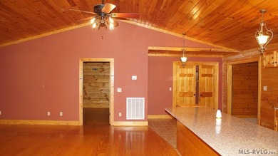 Discover the charm of this stunning log cabin home, which offers - photo 11