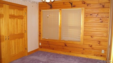 Discover the charm of this stunning log cabin home, which offers - photo 13