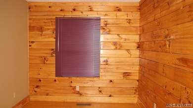 Discover the charm of this stunning log cabin home, which offers - photo 15