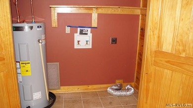 Discover the charm of this stunning log cabin home, which offers - photo 19