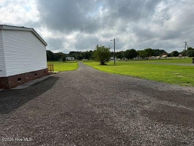This beautifully updated 3-bedroom, 2-bath manufactured home is - photo 3