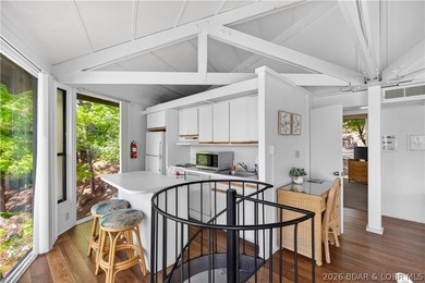 Enjoy treehouse-style living with true lakefront views and all - photo 1