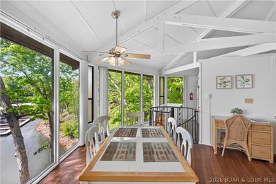 Enjoy treehouse-style living with true lakefront views and all - photo 3