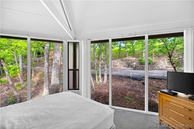 Enjoy treehouse-style living with true lakefront views and all - photo 7