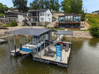 Contemporary luxury meets effortless lake living in this - photo 1