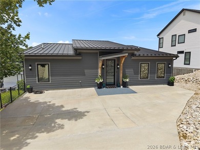 Contemporary luxury meets effortless lake living in this - photo 3