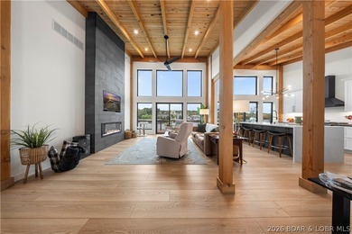 Contemporary luxury meets effortless lake living in this - photo 4