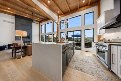 Contemporary luxury meets effortless lake living in this - photo 5