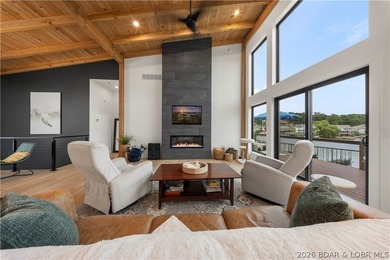 Contemporary luxury meets effortless lake living in this - photo 6