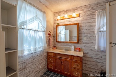 Lakefront home with Endless Potential! This 3-bedroom, 2-bath - photo 7