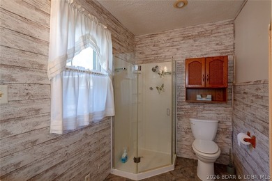 Lakefront home with Endless Potential! This 3-bedroom, 2-bath - photo 8