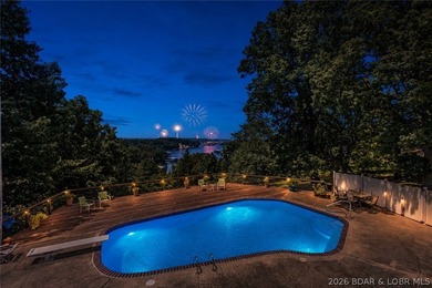 Nestled on over 2 acres with panoramic views of Lake of the - photo 1