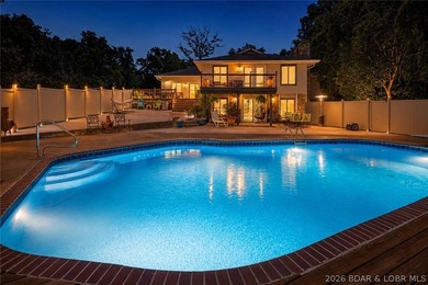 Nestled on over 2 acres with panoramic views of Lake of the - photo 2
