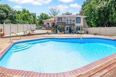 Nestled on over 2 acres with panoramic views of Lake of the - photo 4