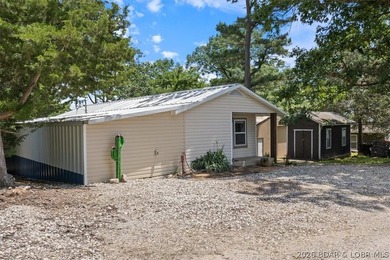 Welcome to your lake retreat! This darling cabin is in a quiet - photo 3